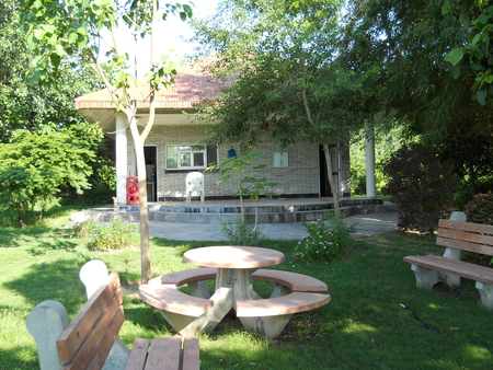 Welcome Refreshment Point at the back nine. - hut, benches, grass, trees