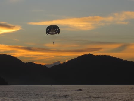 Parachute Penang Sunset - clouds, water, people, parachute, sea, ocean, mountain, sport, sunset, nature, red, cloud, golden, sky