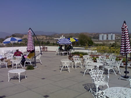 Club House Terrace - chairs, table, umbrella, sky