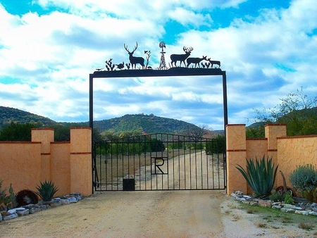 Gates to Hill Country Vistas, South Texas - sky, plants, fence, gates