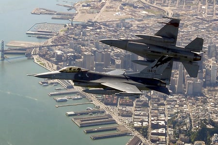 F-16 - over the san francisco bay area, two f-16 fighting falcons begin to roll into position for a rapi