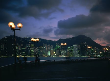 A night storm is approaching - lights, wallpaper, skyscrapers, wall, pic, lamps, view, picture, photography, city, image, water, photo, night, sky, storm, clouds, people