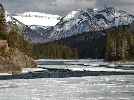 Bow River, Banff National Park, Alberta, Canada - clouds, trees, winter, water, snow, rock, forest, mountain, river, ice, white, cold, sky