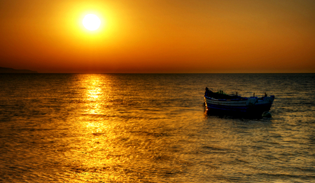 Golden Sunset - boat, splendor, light, reflection, golden sunset, view, golden, sky, sun, clouds, sunlight, water, beautiful, sea, beauty, lovely, ocean, boats, nature, sunset, peaceful