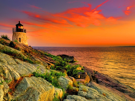 Castle lighthouse - hill, clouds, water, lighthouse, beautiful, sea, ocean, stones, sunset, red, castle, sky, rocks