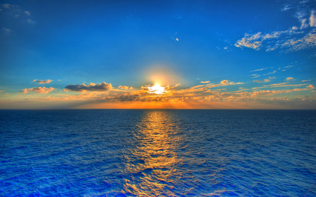 A new day - clouds, oceans, water, yellow, blue, image, amazing, beauty, sunrise, morning, nature, places, background, sun, sky