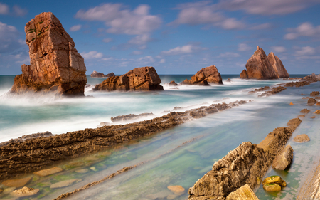 Rocks at sea. - sky, beach, cloud, water, rock, sea, wave