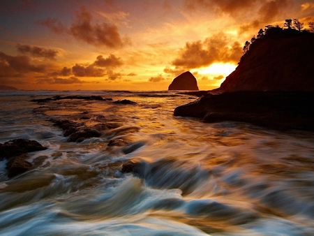 The beautiful color of the sunset - rock, beach, sundown, ocean, sky, clouds, golden, sunset, sea, nature, color, waves