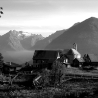 beautiful farm in front of a mountain range