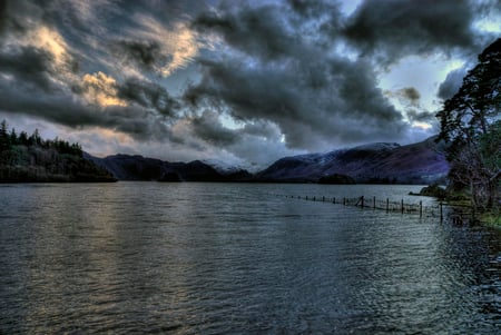 Dark Day at the Lake - clouds, trees, hills, blue, lake, fence, dark, sky