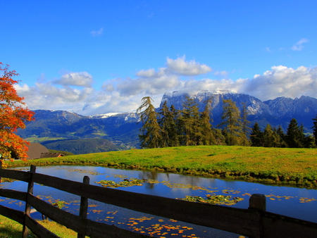 A quiet day in the mountain - slope, sky, trees, water, creek, calm, quiet, clouds, river, sunny, fence, mountain, hills, day, summer, peak, nature