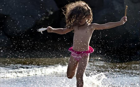 Fun on the Beach - splashes, shark toy, fun, water, beach, stick, child, playing