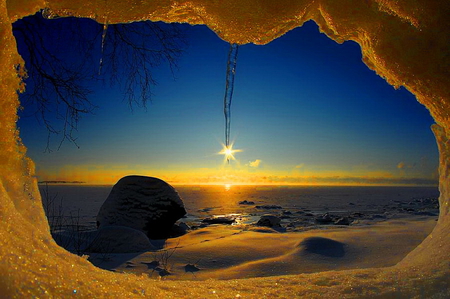 Snowy window at sunrise - blue, window, snow, sunrise, reflection, sun stream, frost, sky, sunlight, winter, water, sea, sunshine, ocean, nature, sunset, bright