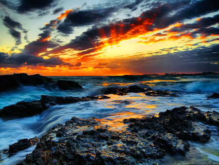 Rough sea at sunset - rocks, water, beautiful, sundown, rough, sky, reflection, clouds, sunset, nature, waves