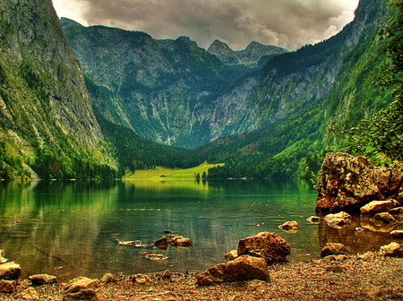 Emerald calmness - calm, hills, beautifulwaters, beach, reflection, mountain, calmness, lake, emerald, sky, clouds, peaks, stones, nature, green, peaceful, rocks