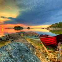 Lonely boat at sunrise