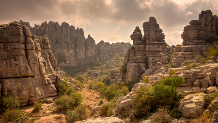 Canyon - rocks, canyon, hot, sky, towers, clouds, arid, bushes, nature, mountain