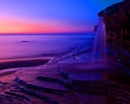 Sea shore at dawn - calm, sundown, sunrise, dawn, purple, sky, sun, falling water, water, sea shore, sea, colors, fall, waterfall, sunset, waves, peaceful, rocks