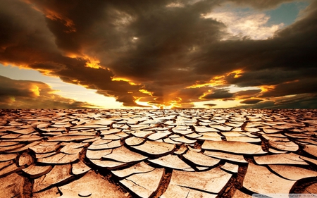 drought - parched land, sunset, dark clouds, arid