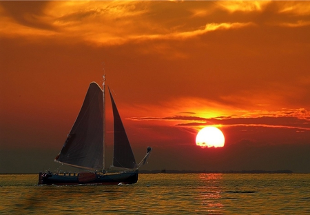 The Long Day is Over - calm, glow, boat, sea, ocean, sails, sun, sky