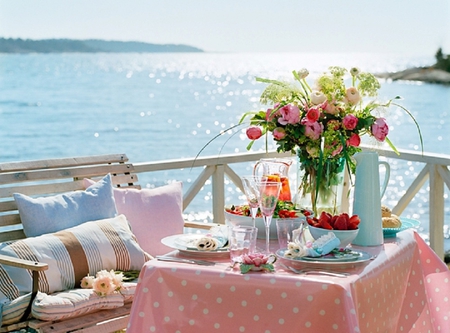 Sweet Morning - beauty, sky, roses, glasses, photography, sun, water, bench, breakfest, amazing, view, table, morning, ocean, cushion, sunlight, soft, lovely, nature, balcony, strawberries, blue, pink, beautiful, sweet, flowers, sea