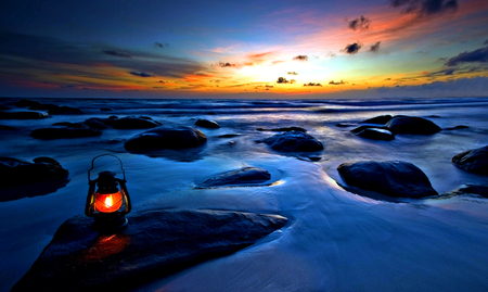 Beautiful Sea - beauty, sky, peaceful, sunset, view, clouds, lamp, ocean, light, blue sea, lovely, nature, beautiful, blue, splendor, stones, sea, sunrise