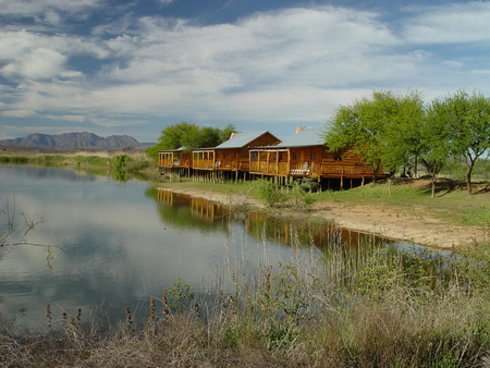 river huts in africa - mountain, huts, trees, river