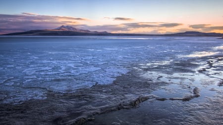 winter on the lake - ice, lake, sunset, shore, distant mountains