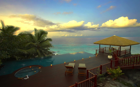 Villa in Seycheles - clouds, cabin, blue sky, sea, seycheles, palmtrees, flowers, villa, pool, lights, garden, plants, armchairs