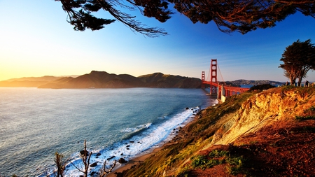 different angle of golden gate bridge - shore, bridge, bay, sun