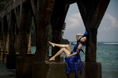 Hot lady in blue (For Andreea) - clouds, passionate, btunette, water, legs, sensual, amazing, blue dress, beauty, ocean, wonderful, hot lady, sexy, sky, bridge