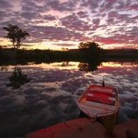 A boat at sunset background