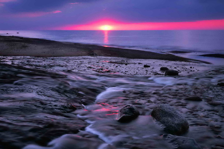 Purple sunset - clouds, sundown, beach, sea, ocean, reflection, stones, shore, sunset, nature, purple, waves, waters, dusk, sky