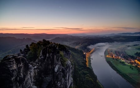 village on the river at dusk - village, river, light, dusk, mist, cliffs