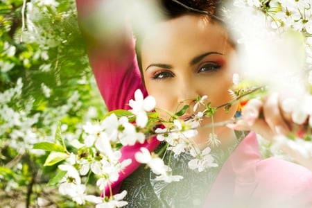 Beauty in spring - beauty, sunshine, stare, brown eyes, eyes, beautiful lady, spring, nature, face, blossom, colors, flowers, sunny day