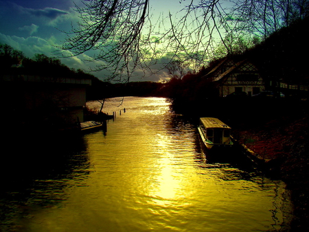 Glowing river - sky, trees, peaceful, water, stream, mirrored, calm, reflection, glowing, river, clouds, golden, afternoon, dusk, branches, boats, light, night, nature