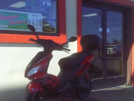 Some dudes motorcycle - motorcycle, doors, handles, store, red